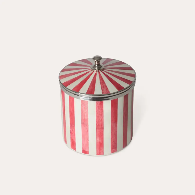 Red and white striped ice bucket with a chrome silver lid on a light beige background.